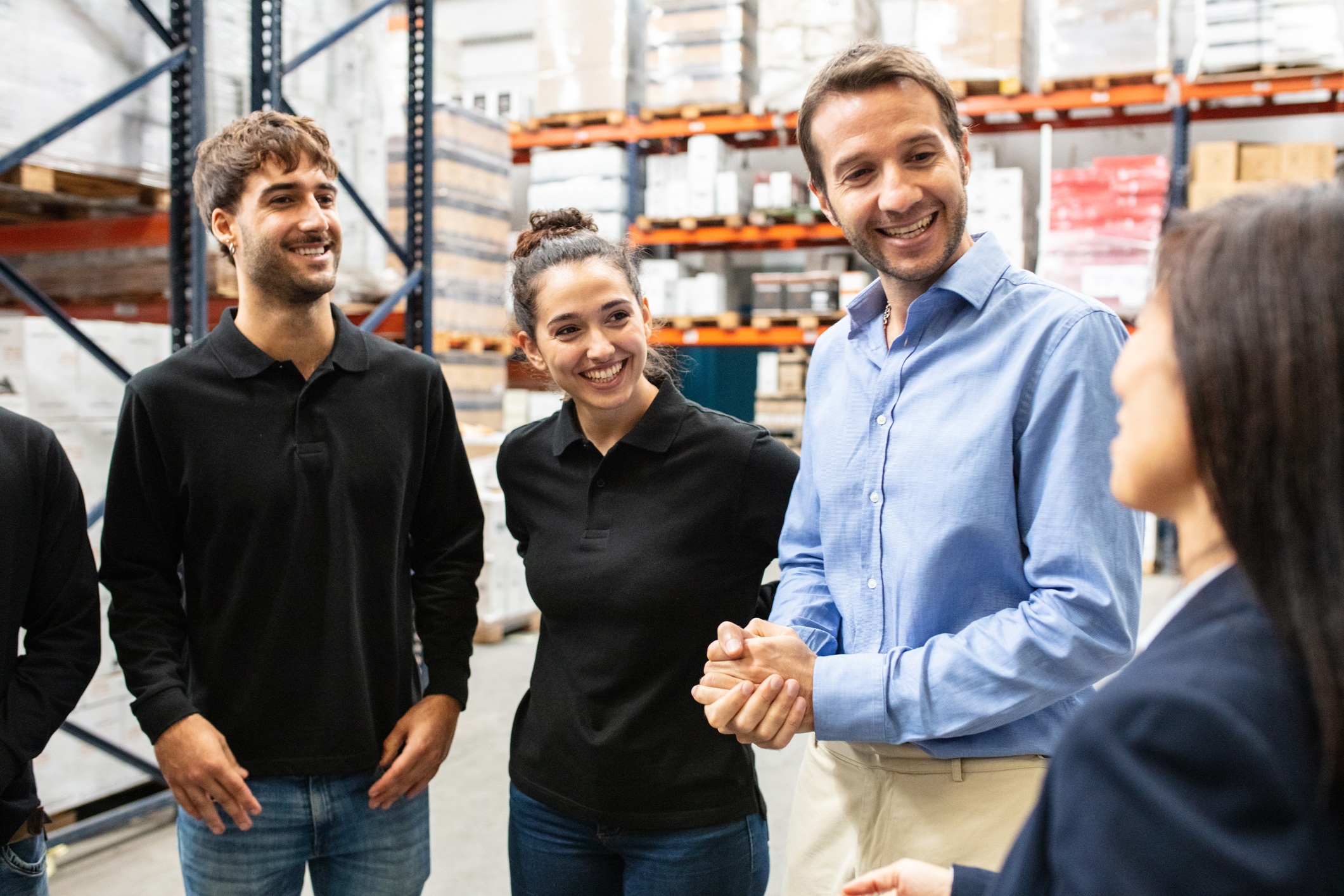 Warehouse foreman meeting with workers